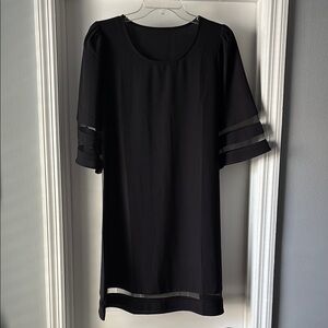 Elegant Black Dress with Sheer Sleeve Accents